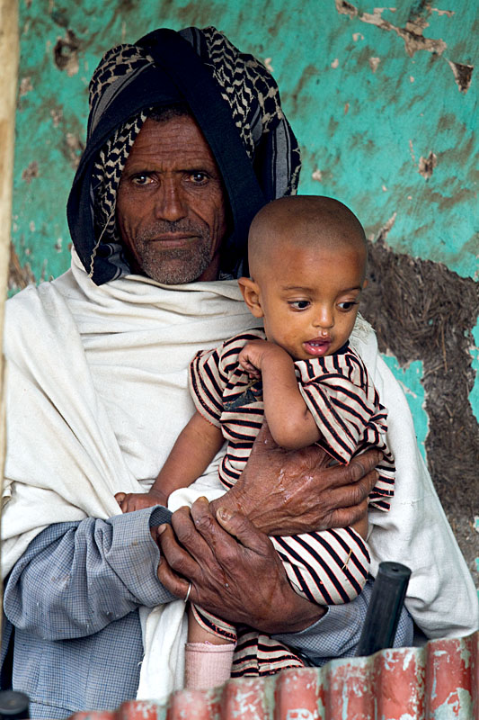 69   Proud father with his daughter from the Raya Wollo tribe at Hayk market. Ethiopia